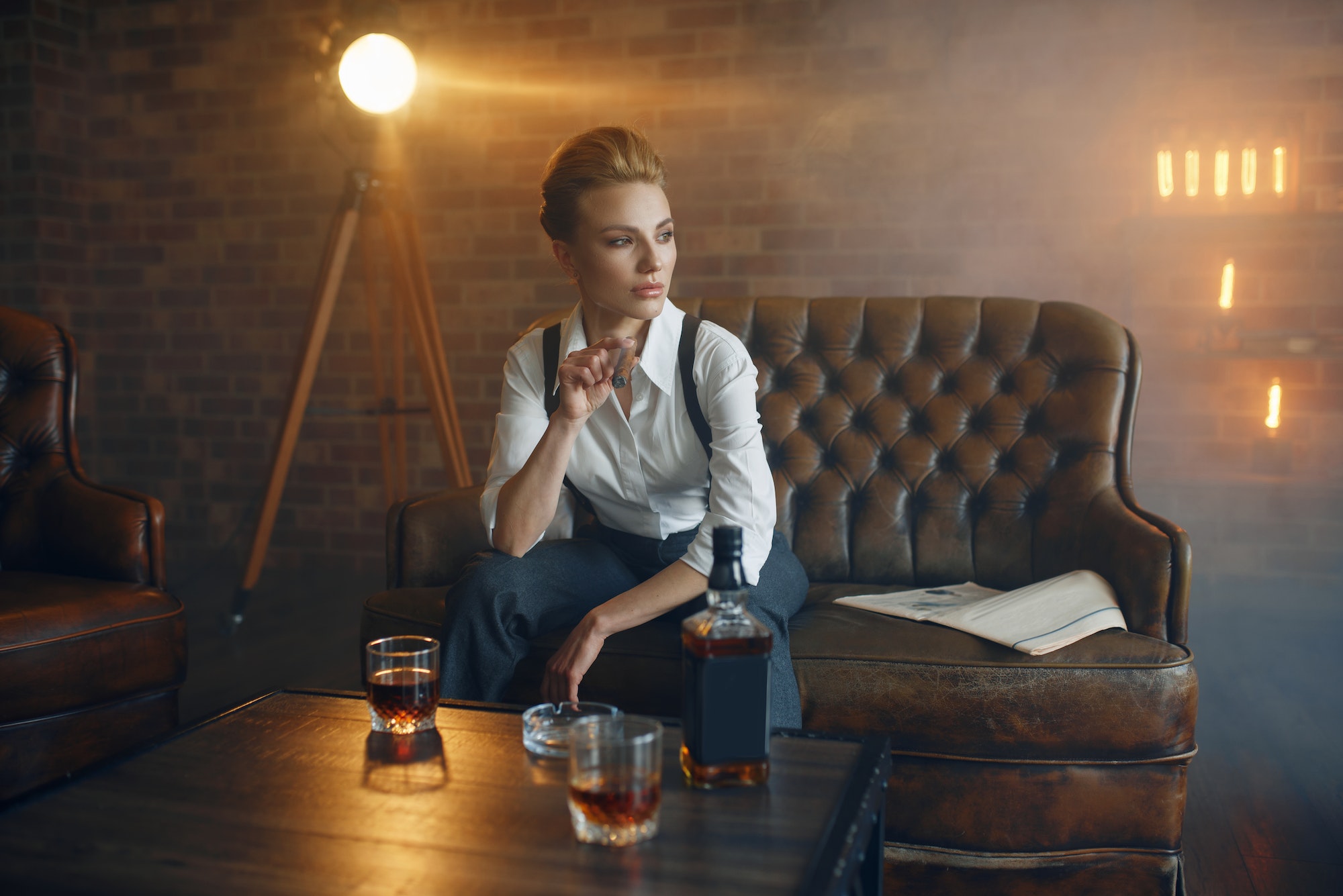 Woman at the table with whiskey, gangster style